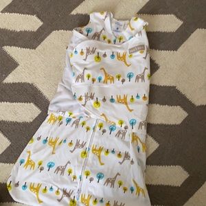 Halo sleep sack swaddle with giraffe print.